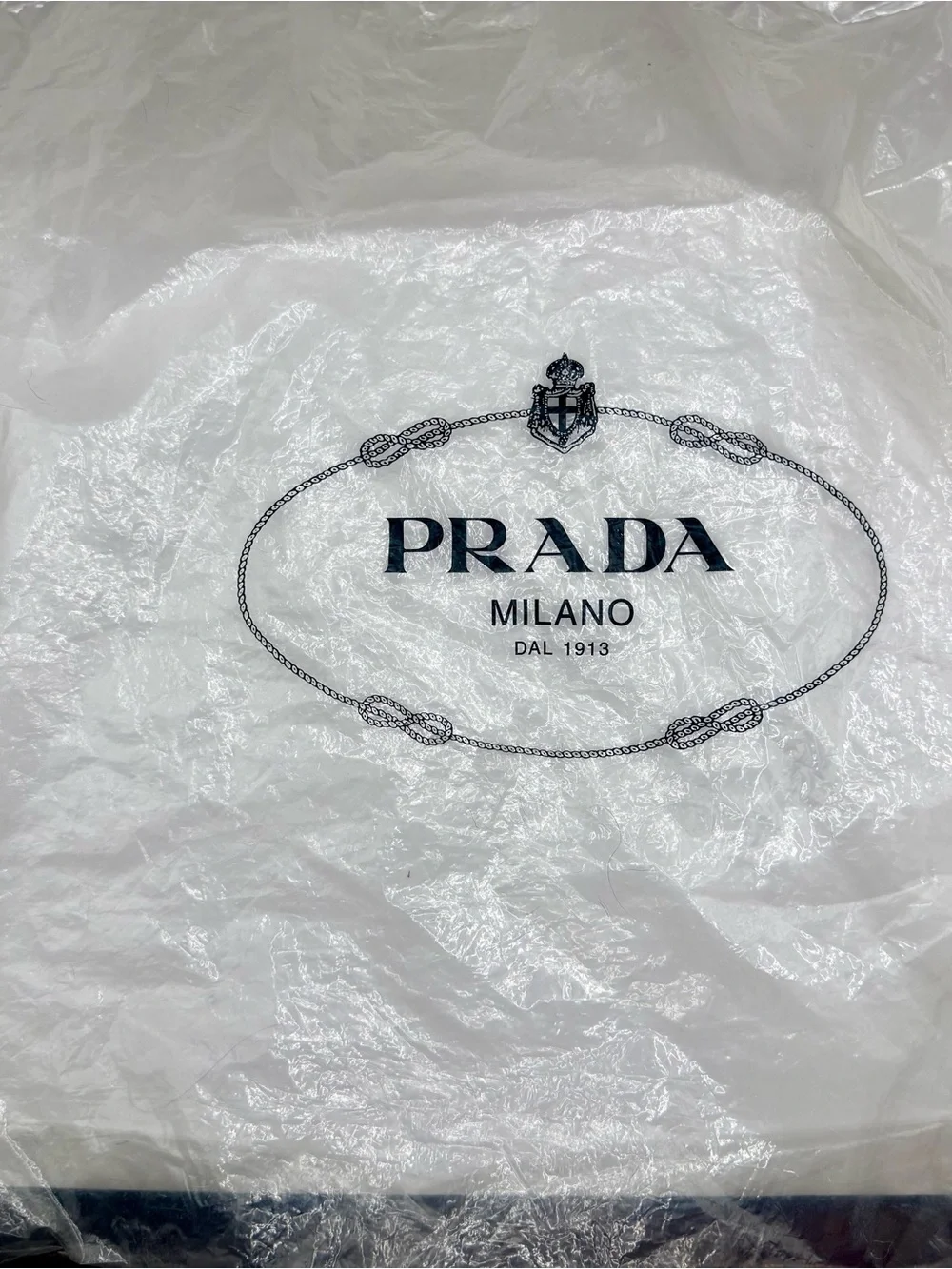 Prada Black Nylon & Leather Bag with Embossed Prada logo.
